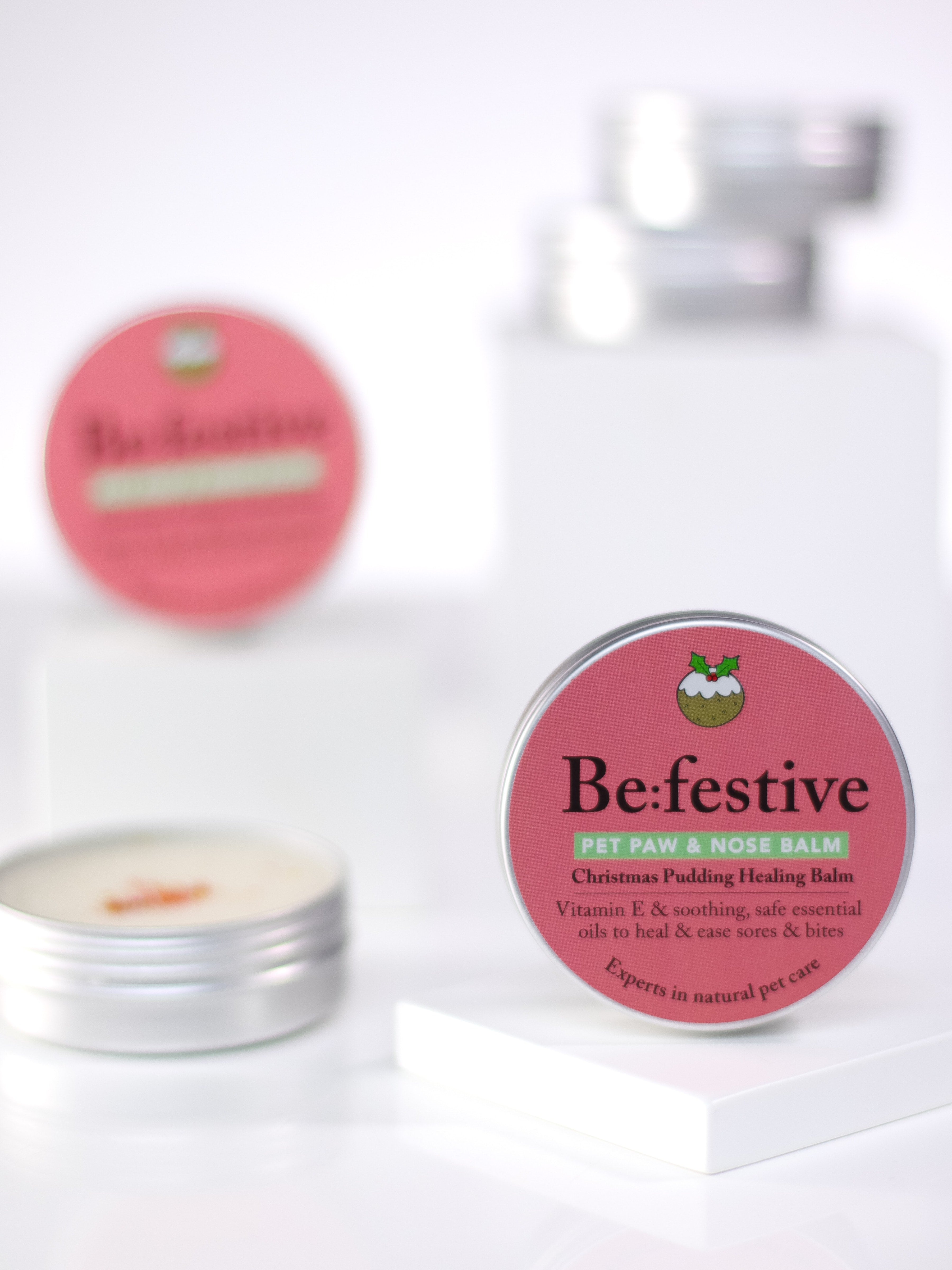 Be:Festive balm - one with the tin lid off and one with the lid on