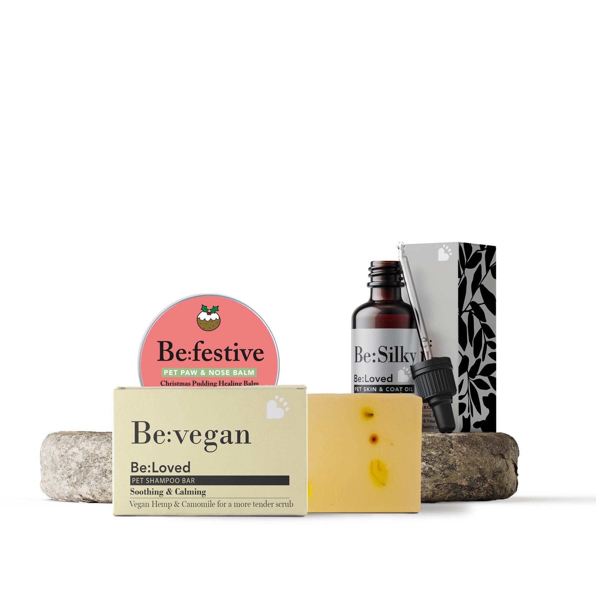 Be:Festive Balm, Be:Vegan Shampoo bar and Be:Silky oil on a white background