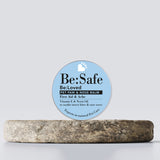 Be:safe pet paw and nose balm on a wooden tray.