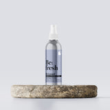 Be:fresh spray product on a wooden tray.